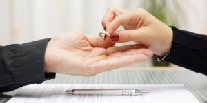 woman returned wedding ring to husband . Divorce concept